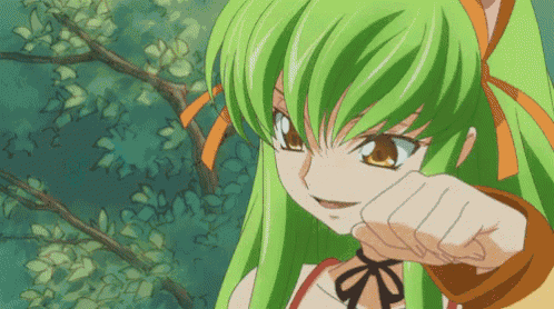 a girl with green hair is pointing with her fist