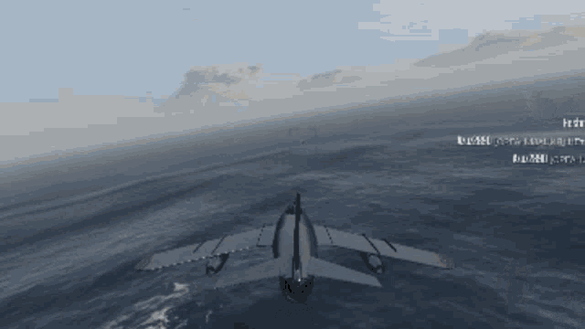 a plane is flying over a body of water with a few words written on the bottom