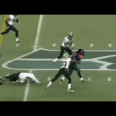 a football player with the number 8 on his jersey is running down the field