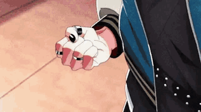 a close up of a person 's hands with rings on them .