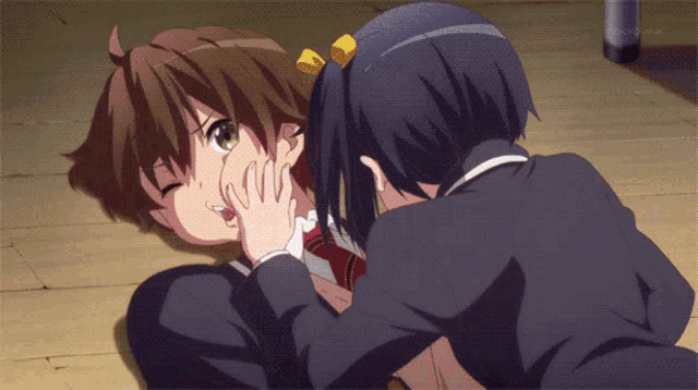 a tokyo mx logo can be seen in the background of a cartoon