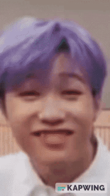 a close up of a person 's face with purple hair and the word kapwing on the bottom