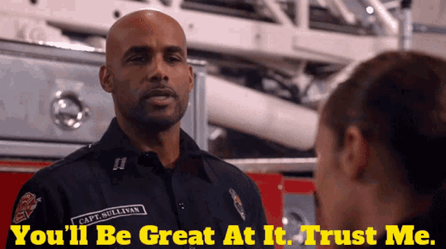 a man with the name capt sullivan on his uniform talks to a woman