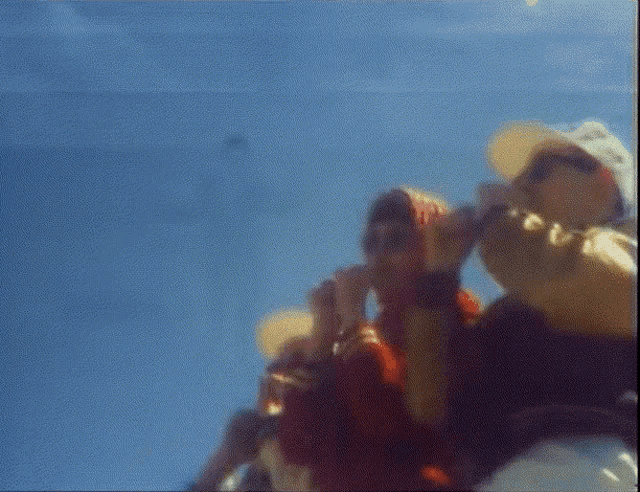a group of people raising their fist in the air