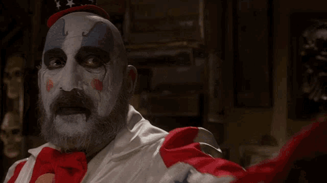 a man in a clown costume holding a gun