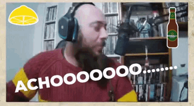 a man with a beard wearing headphones says " achooooooo "