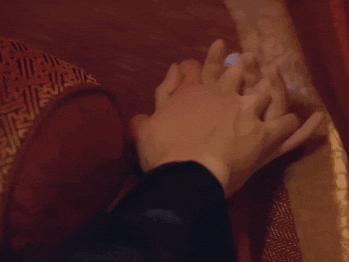 a close up of a man and woman kissing