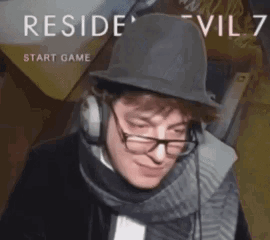 a man wearing a hat and headphones is playing a video game