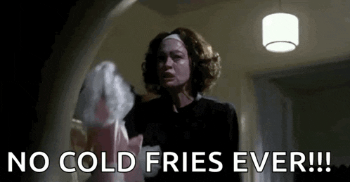 a woman is holding a bag of french fries and saying `` no cold fries ever !! ''