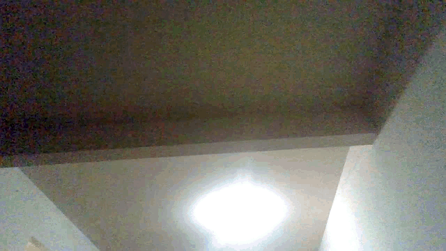 a light hanging from the ceiling of a room