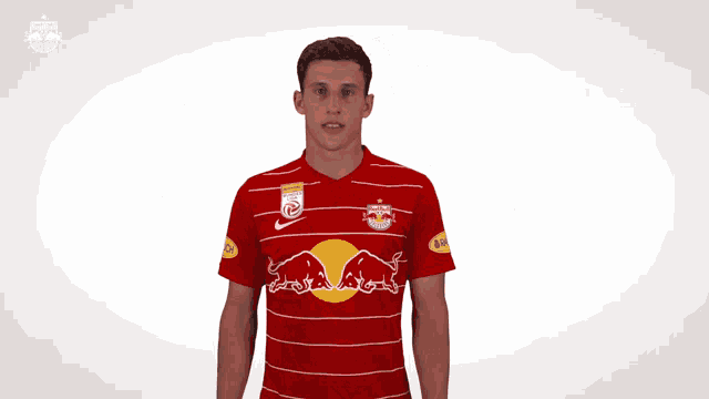 a man wearing a red bulls jersey with the number one on it