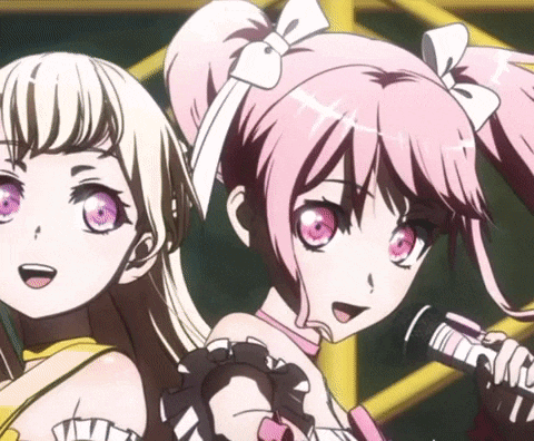 two anime girls are standing next to each other and one of them is holding a microphone
