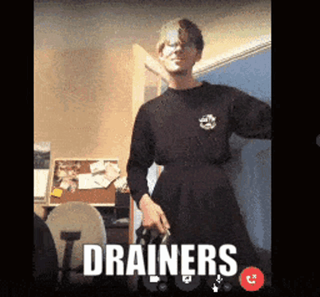 a man is on a video call with the words drainers on the bottom
