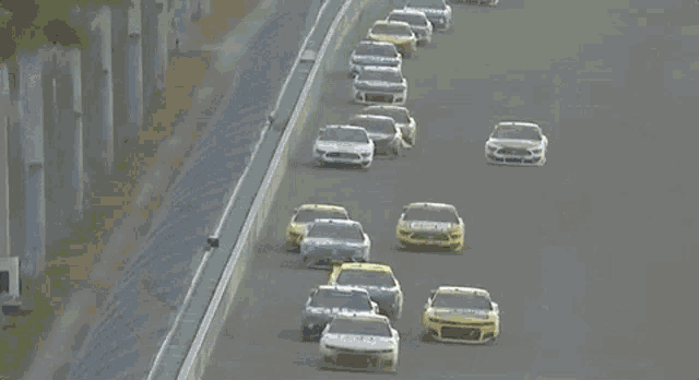 a group of race cars are racing on a track and one of them has the word city on the side