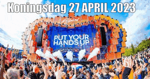 a large crowd of people are gathered in front of a stage that says " put your hands up "