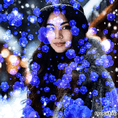 a woman is surrounded by blue flowers and the website progif.ru is visible