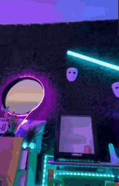 a purple and green room with a mirror and a tablet that says nintendo on it