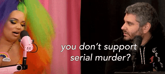 a man and a woman are talking into microphones with the words " you don 't support serial murder "