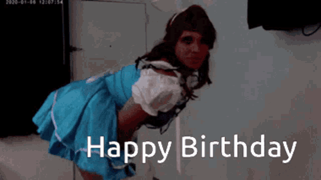 a woman in a blue dress is tied up with the words happy birthday below her