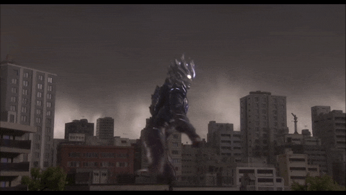 a monster is standing in front of a city with a purple light coming out of its mouth .