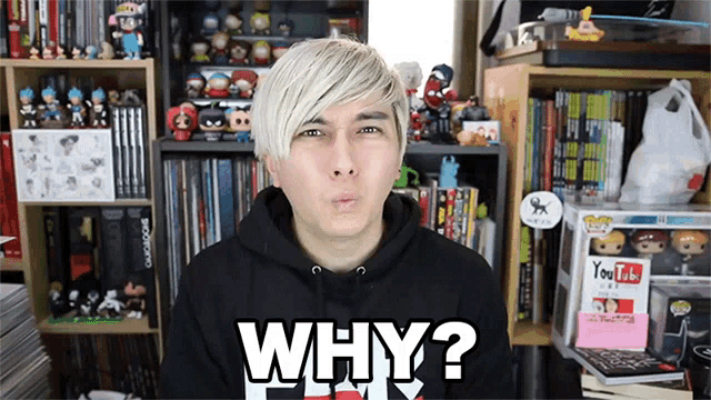 a man wearing a black hoodie with the words why on it