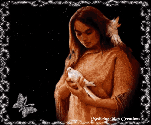 a woman is holding a white bird in her hands and the words medicine man creations are on the bottom right