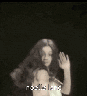 a woman in a white dress is dancing and the words noelle land are visible .