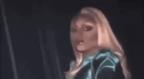 a close up of a doll 's face in a dark room .
