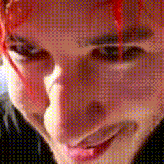 a close up of a person 's face with blood on it