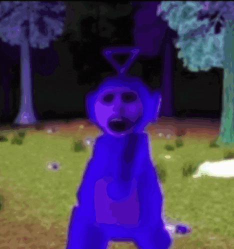 a purple teddy bear with a triangle on its head