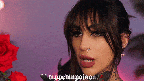 a close up of a woman 's face with the words dipped in poison written on the bottom