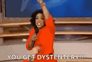 a woman in a red dress is holding a microphone and saying `` you get dystentory '' .