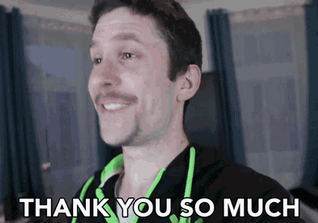 a man says thank you so much in front of a window