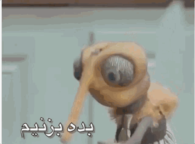 a cartoon character with a long nose and a tie is standing in front of a door .
