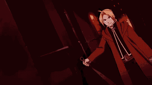 a man in a red coat is holding a large sword with spikes