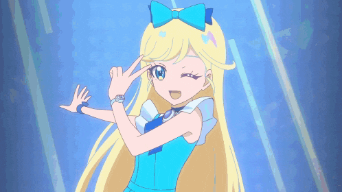 a blonde anime girl with a blue bow on her head