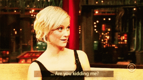 a woman in a black dress says " are you kidding me ? "