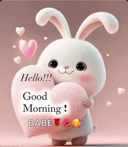 a stuffed bunny is holding a pink heart and says good morning babe