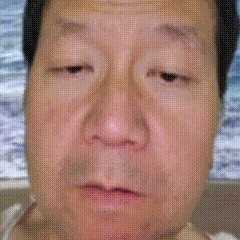 a close up of a woman 's face with her eyes closed .