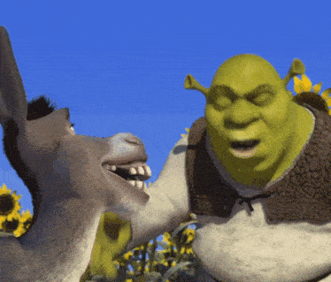 shrek and a donkey standing next to each other
