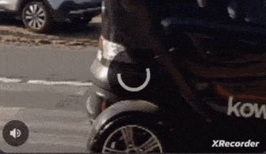 a black vehicle with the word kow on the side