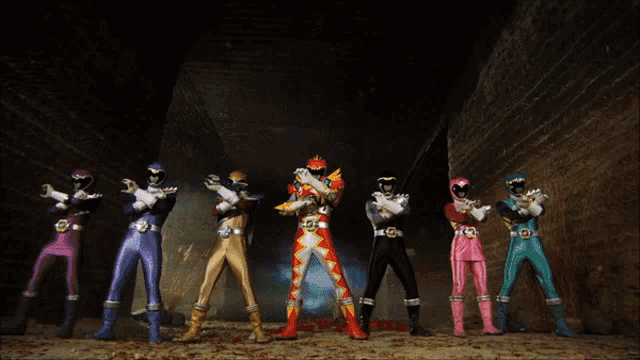 a group of power rangers are standing in front of a sign that says ' mighty morphin power rangers '
