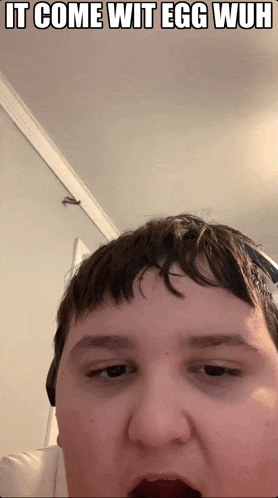 a man with his mouth open and the words it come wit egg wuh on the bottom