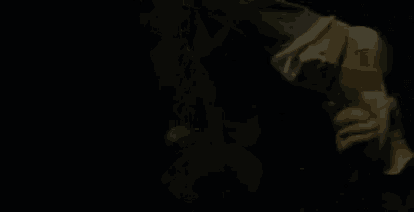 a person 's feet are visible in the dark .