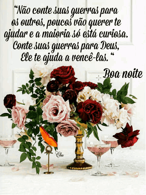 a bouquet of flowers sits on a table next to a quote