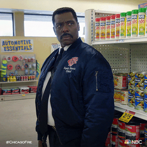 a man wearing a jacket that says chicago fire chief
