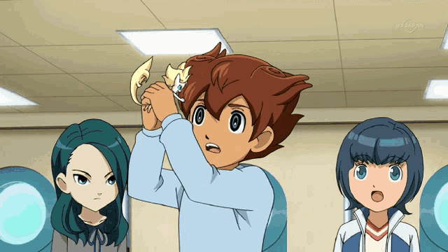 a group of anime characters are standing in a room with a sign that says tv tokyo in the corner