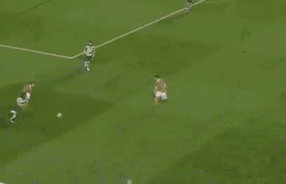 a group of soccer players are playing on a field .