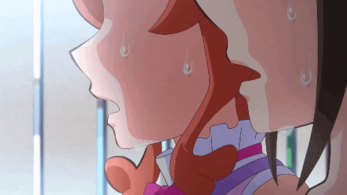 a close up of a girl 's face with sweat dripping from her forehead