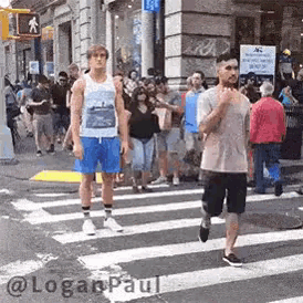 a group of people are crossing a street in front of a store .